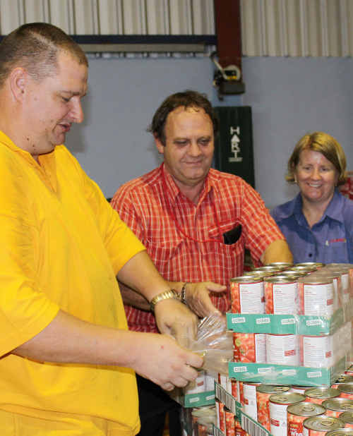 CHIPPING IN: CHRC Mayor Peter Maguire visited the PCYC on Monday where Coles store manager Darrin Simpson and his staff were setting up the store with non perishables and household essentials. ig-170111-001 CHIPPING IN: CHRC Mayor Peter Maguire visited the PCYC on Monday where Coles store manager Darrin Simpson and his staff were setting up the store with non perishables and household essentials. ig-170111-001